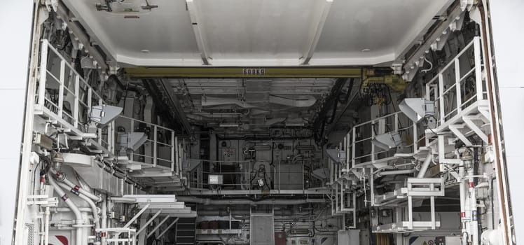 The interior of a machine room in inside a ship.