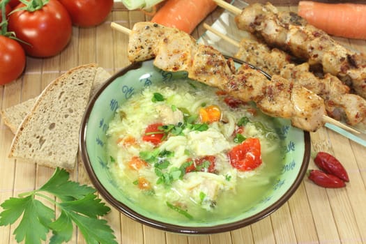 a chicken soup with egg and parsley