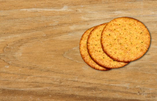 whole grain crackers on wood background