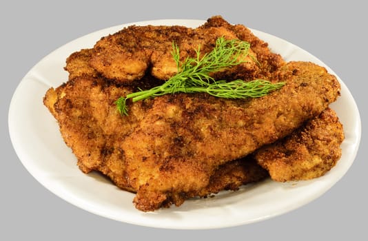 Thicken chops on the white plate. Isolated on the gray background.