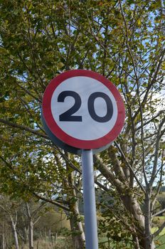 British 20mph traffic road sign.