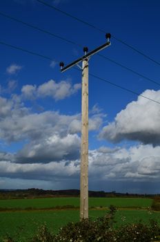 Wooden electricity pole in a rural setting in England.