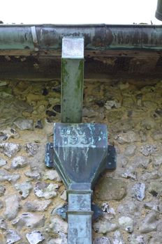 Victorian lead guttering and down pipe on a building in Sussex,England.