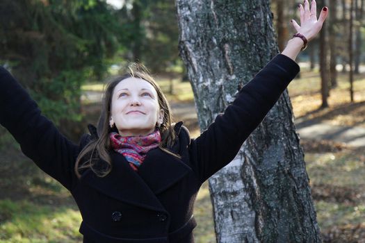 beautiful girl in a park on an autumn-day