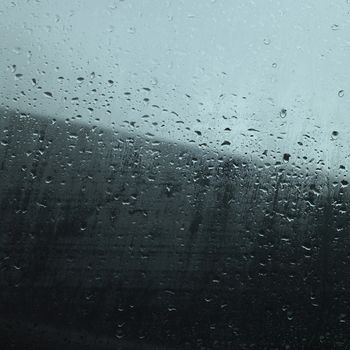 Blurry rain drops in a window