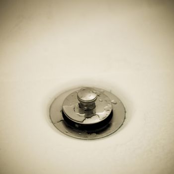 Close up of a silver drain