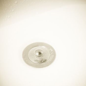 Close up of a silver drain