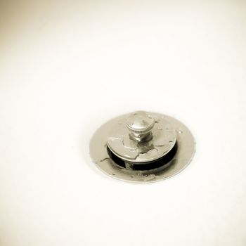 Close up of a silver drain