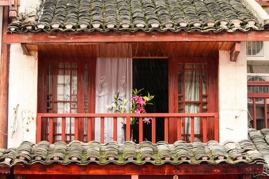 Normal chinese home balcony with beautiful flowers