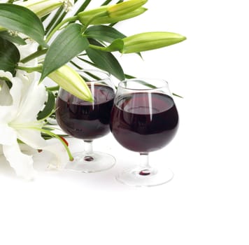 Wine and flowers on white background