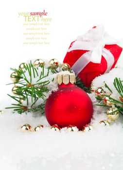 Christmas balls and fir branches with decorations isolated over white