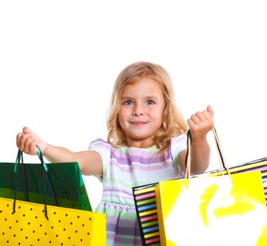 Shopping little girl happy smiling holding shopping bags isolated on white background.