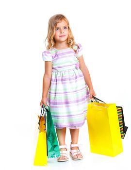Shopping little girl happy smiling holding shopping bags isolated on white background.
