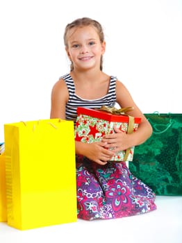 Shopping little girl happy smiling holding shopping bags isolated on white background.