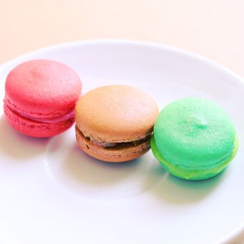 Tasty colorful macaroons with retro filter effect