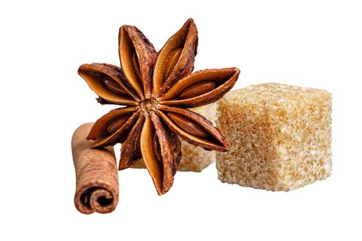 Still life of cinnamon, star anise and sugar cubes isolated on white background