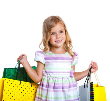 Shopping little girl happy smiling holding shopping bags isolated on white background.