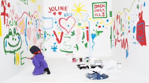 Young Girl Painting in a white room