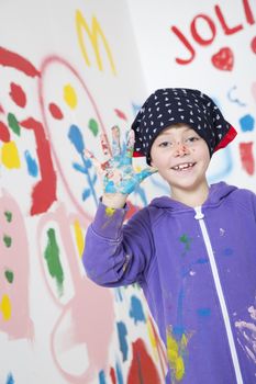 Happy young Girl with paint on her hand