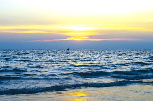 nature background blue sky with sun set and dark sea