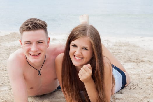 young happy couple in summer holiday vacation summertime beach