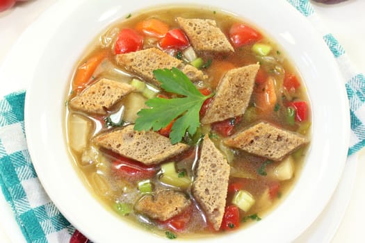 a plate with a colorful bread soup