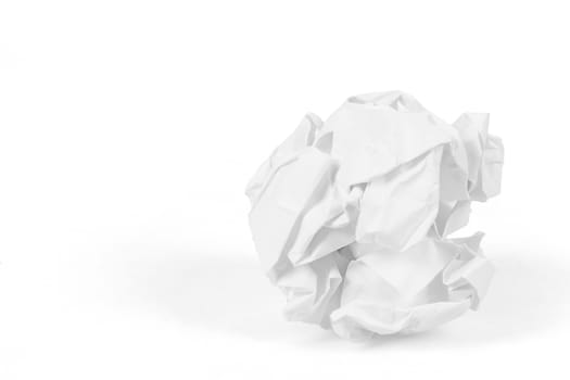close-up of crumpled paper ball on white background