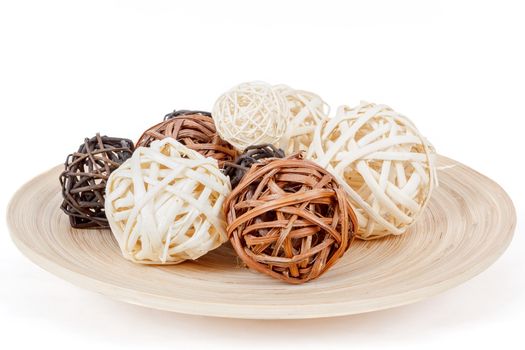 decorative wicker wooden balls on isolated white