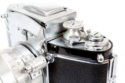 detail view of retro old vintage analog photo camera on white background view from the side