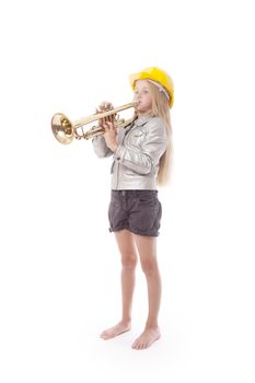 young girl with yellow helmet playing trumpet against white background