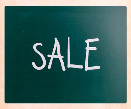 "Sale" handwritten with white chalk on a blackboard