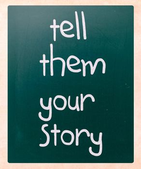 "Tell them your story" handwritten with white chalk on a blackboard