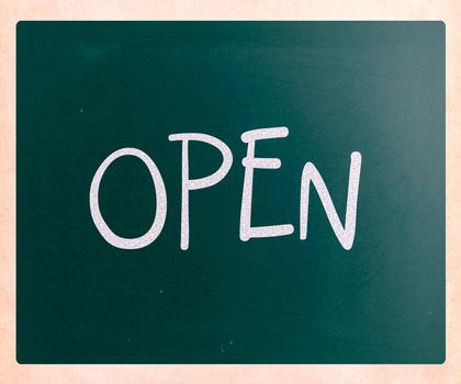 The word "Open" handwritten with white chalk on a blackboard