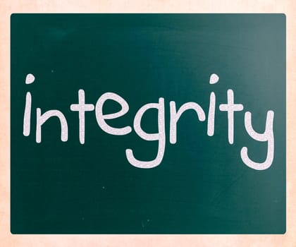 "Integrity" handwritten with white chalk on a blackboard