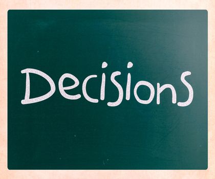 The word "Decisions" handwritten with white chalk on a blackboard