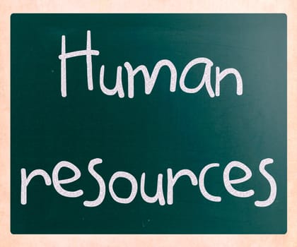 The word 'Human resources' handwritten with white chalk on a blackboard