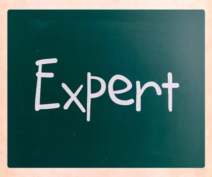 The word "Expert" handwritten with white chalk on a blackboard