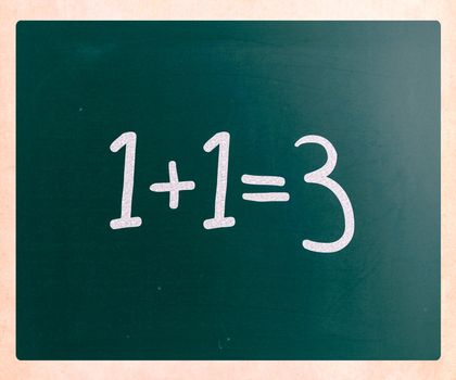 1+1=3 handwritten with white chalk on a blackboard