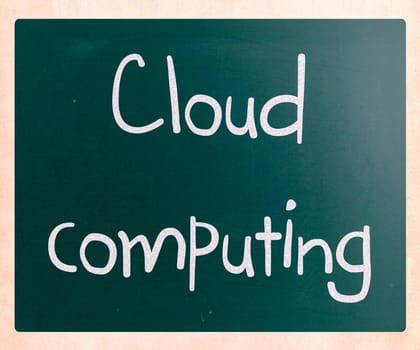 "Cloud computing" handwritten with white chalk on a blackboard