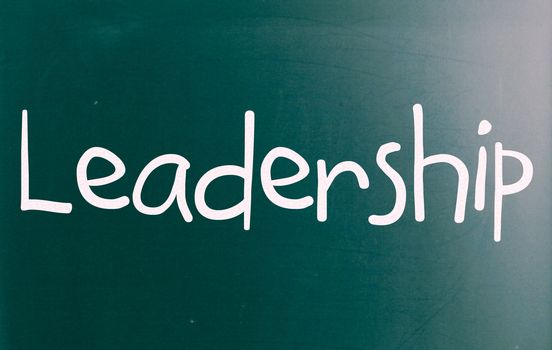 The word "Leadership" handwritten with white chalk on a blackboard