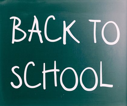"Back to school" handwritten with white chalk on a blackboard