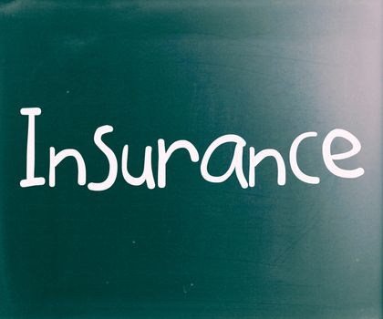 The word "Insurance" handwritten with white chalk on a blackboard