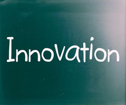 The word "Innovation" handwritten with white chalk on a blackboard