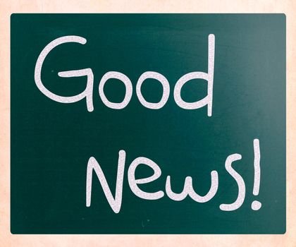 "Good News!" handwritten with white chalk on a blackboard