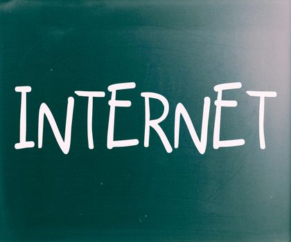 The word "Internet" handwritten with white chalk on a blackboard