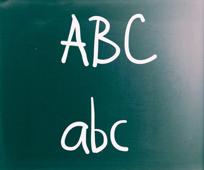 "ABC" handwritten with white chalk on a blackboard