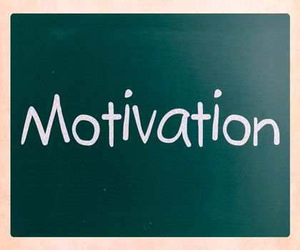 "Motivation" handwritten with white chalk on a blackboard