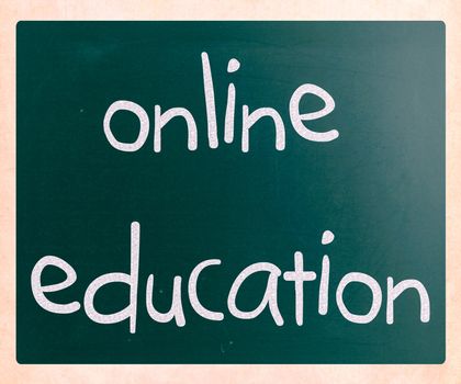 "Online education" handwritten with white chalk on a blackboard