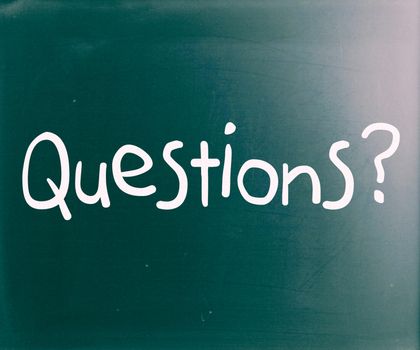 "Question" handwritten with white chalk on a blackboard