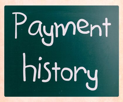 "Payment history" handwritten with white chalk on a blackboard